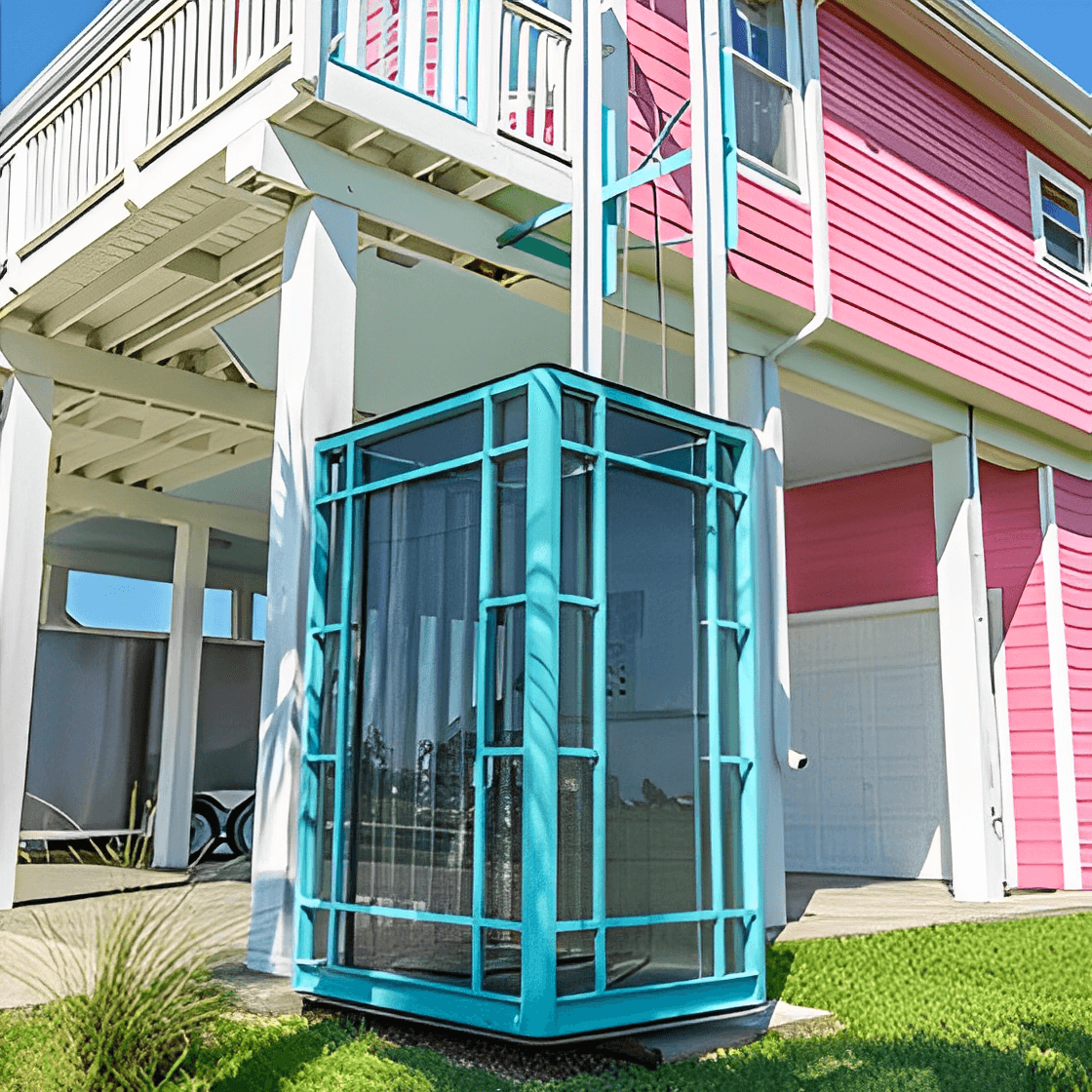 Outdoor glass elevator by pink house.